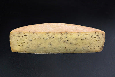 Fromage à raclette aux cèpes et olives